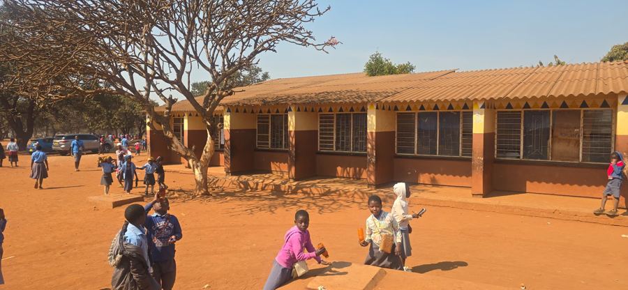Classroom block with learners outside
